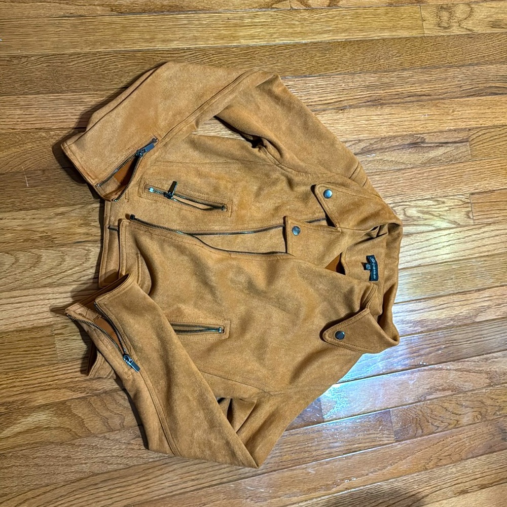 A brown suede jacket in size small